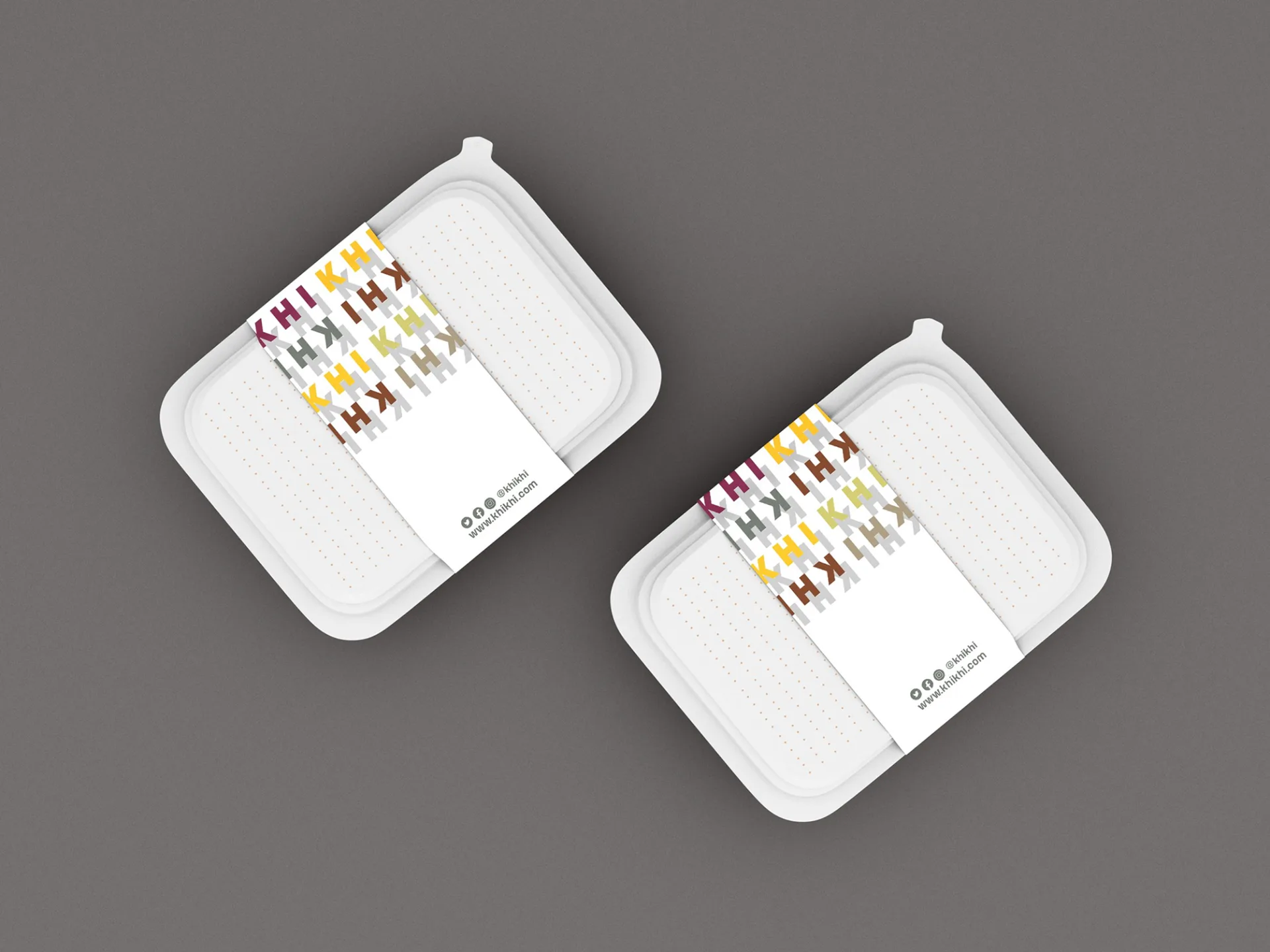 KHI KHI branded takeaway boxes with colorful logo pattern labels showcasing packaging design applications